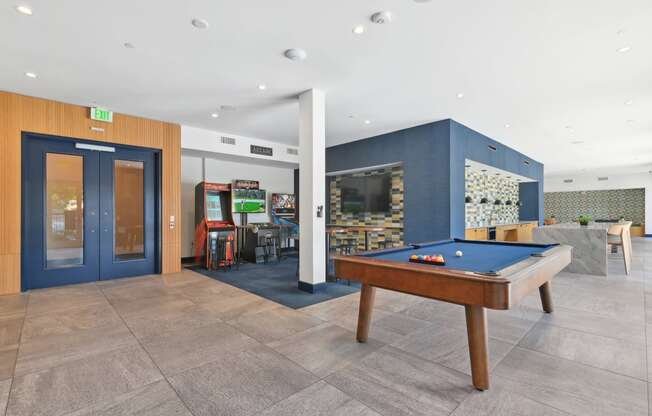 play a game of pool in our games room at our apartments