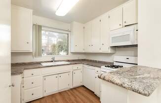 Kitchen with White Appliances and White Cabinets