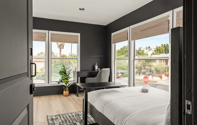 A 4 Bedroom, 3 Bathroom apartment with common areas and a fully functional kitchen at 1476 Malcolm Ave.