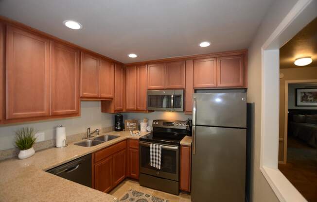 View of Kitchen with wood cabinets and appliances