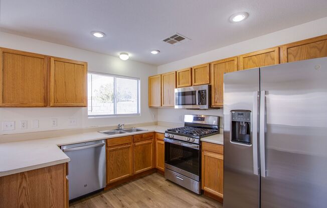 Lovely 4 bedroom 2.5 bath townhome in North Las Vegas gated community with a pool!