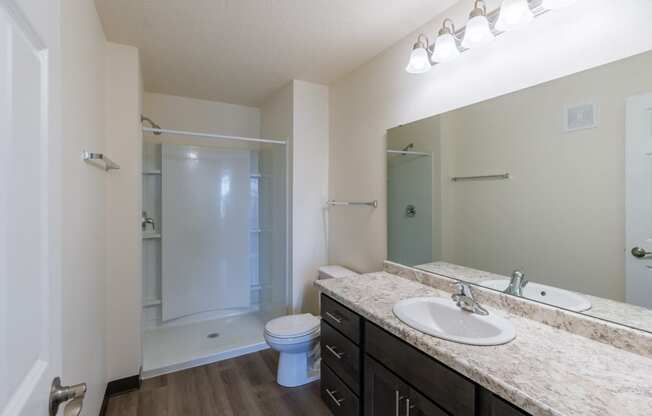 a bathroom with sink and shower. Fargo, ND Stonebridge Apartments