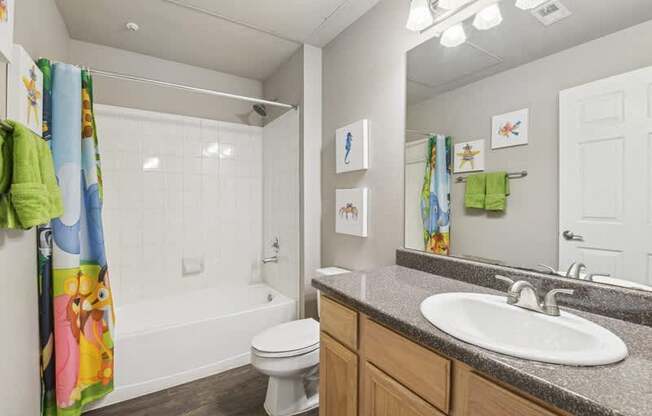 a bathroom with a sink toilet and a shower