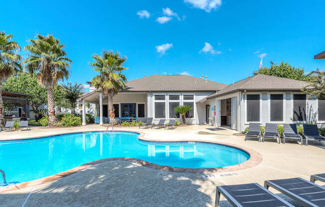 A large house with a pool in the backyard.