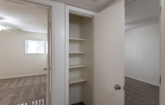 This is a photo of the hall closet in the 871 square foot 2 bedroom, 2 bath apartment at Princeton Court Apartments in the Vickery Meadow neighborhood of Dallas, Texas.