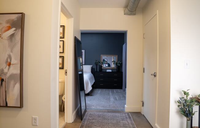 a view of a bedroom from the hallway of a home