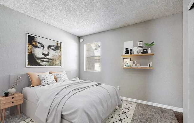 A bedroom with a bed, nightstand, and a painting on the wall.