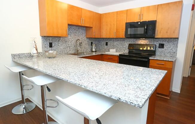 Fitted Kitchen With Island Dining at Withington Apartments, MRD Apartments, Michigan