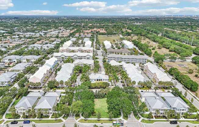 A bird's eye view of a residential area with houses and trees.