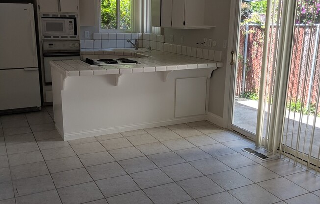 Beautiful Ground Level Front Unit with 2 Car Garage