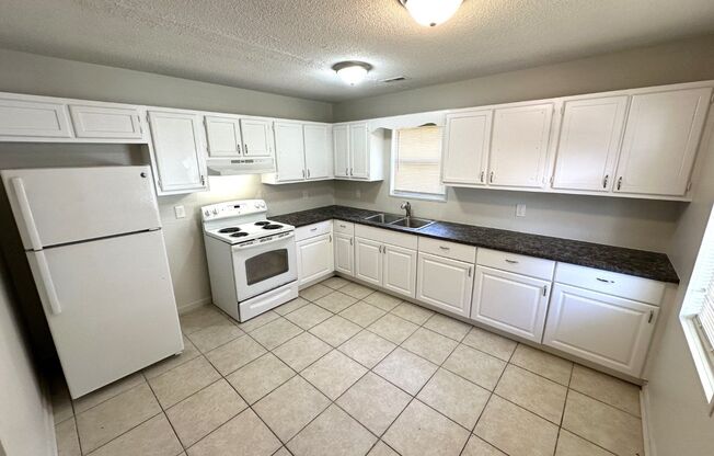 Great location, close to everything, private setting, large rooms, tile floors, huge kitchen, must see!