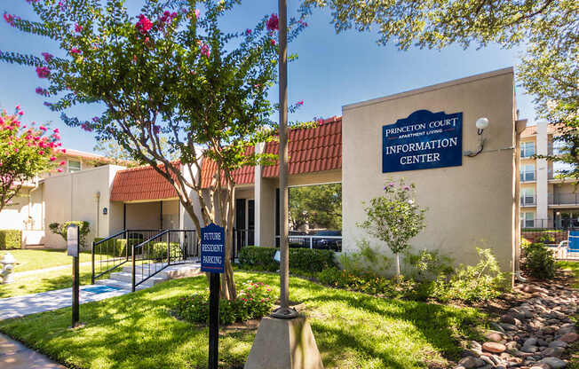 A sign for Princeton Court Information Center is displayed in front of the leasing office at Princeton Court Apartments in the Vickery Midtown neighborhood of Dallas, TX.