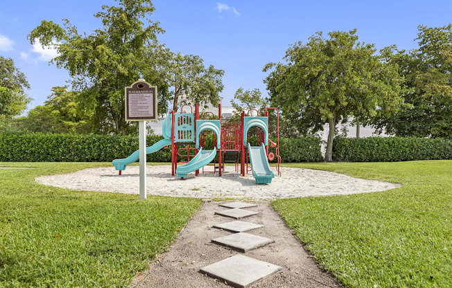 a park with a playground and a sign