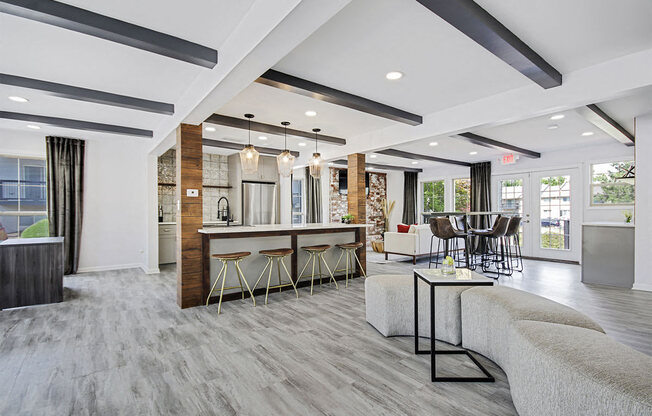 a resident lounge with couches chairs and a table at Southridge, Kansas City, KS, 66103