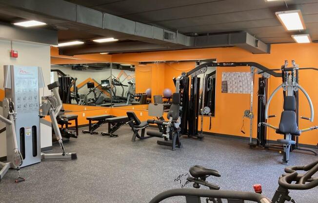 an image of a gym with weights and cardio equipment at Troy Place Apartments - Troy, MI, Michigan