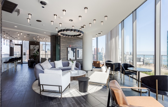 A modern living room with a large window overlooking the city.