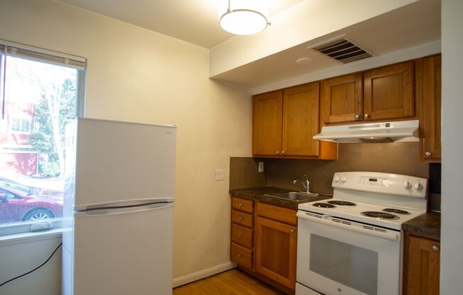 NW Coveted Corner Flat w Hardwood Floors Ready Late June!