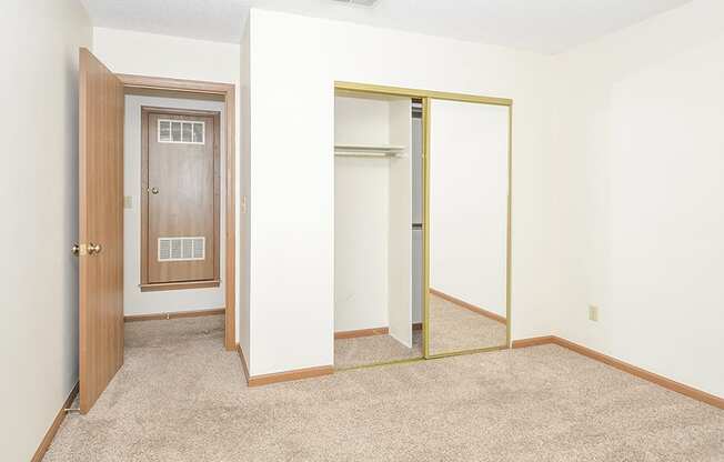 Bedroom with Sliding Glass Mirror Closet Doors