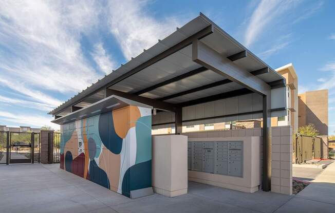 A modern building with a colorful mural on the side.