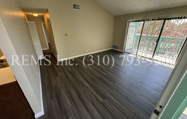 Renovated Upstairs Condo w/ Laundry and Balcony