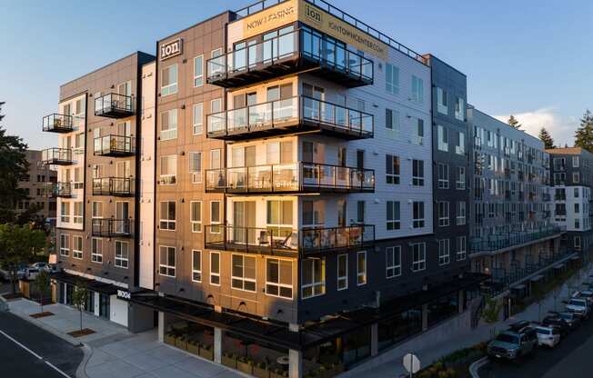 a rendering of a large apartment building with many balconies at Ion Town Center, Shoreline, WA