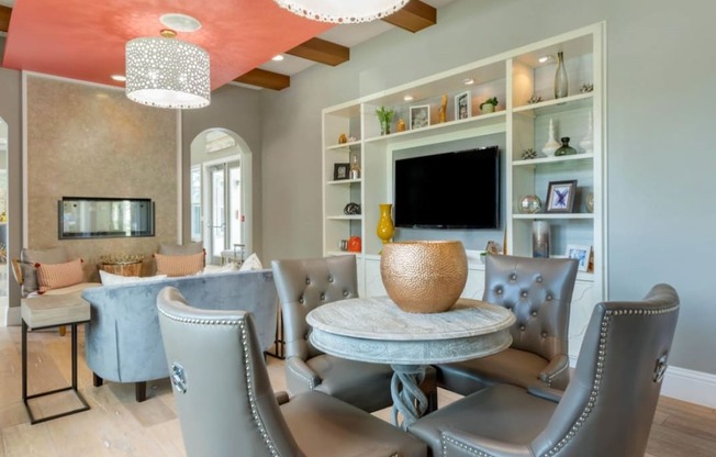 a living room with gray walls and a coral ceiling