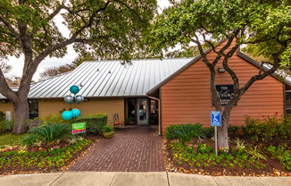 Clubhouse Exterior at The Hollows Apartments in San Antonio, TX