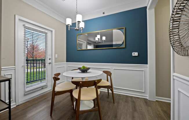 Riverstone - DiningRoom with Wood-StyleFlooring and BlueAccent Wall