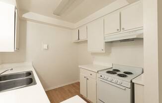 Kitchen with White Appliances and White Cabinets