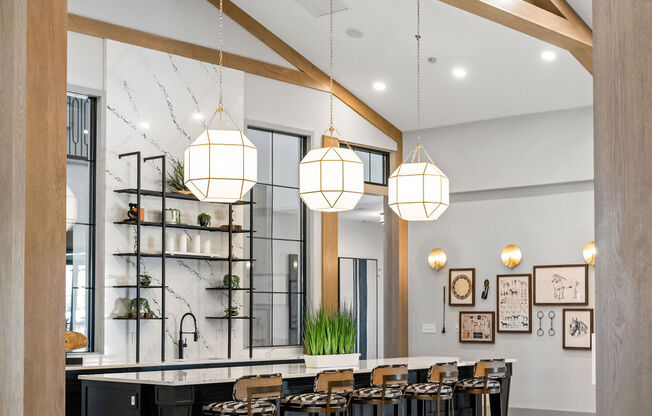 A modern kitchen with a black counter and wooden beams at Madison Prickett Preserve, Yardley
