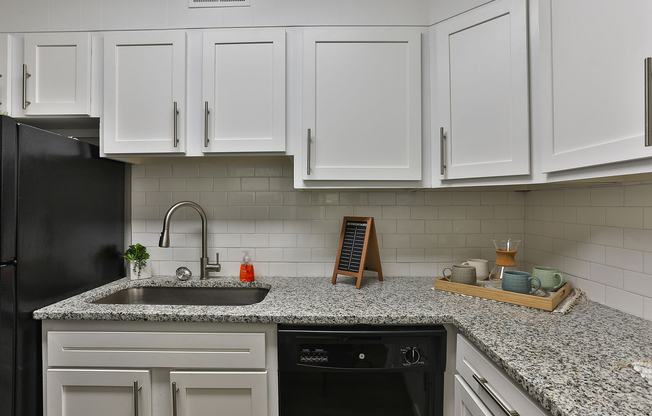 Kitchen with granite counters and modern cabinetry