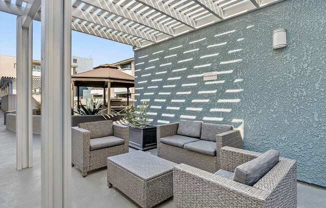 Quiet reading area outside in community courtyard with seating in shade.