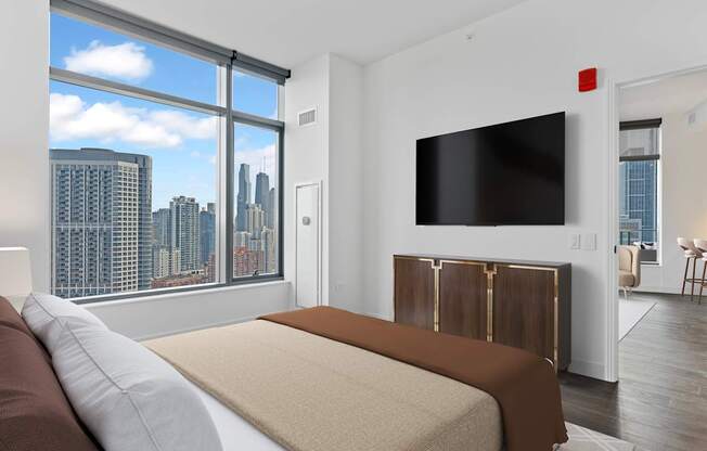 a bedroom with a bed and a large window at Cassidy on Canal, Chicago, IL, 60606