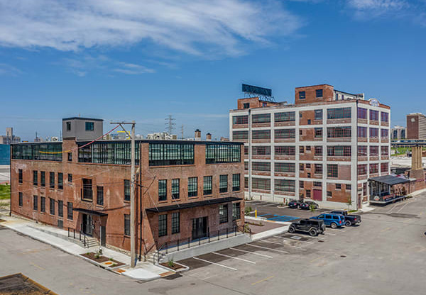 Steelcote Crossing exterior historic brick building with Steelcote Lofts in the background  at Steelcote Square, St. Louis, 63103