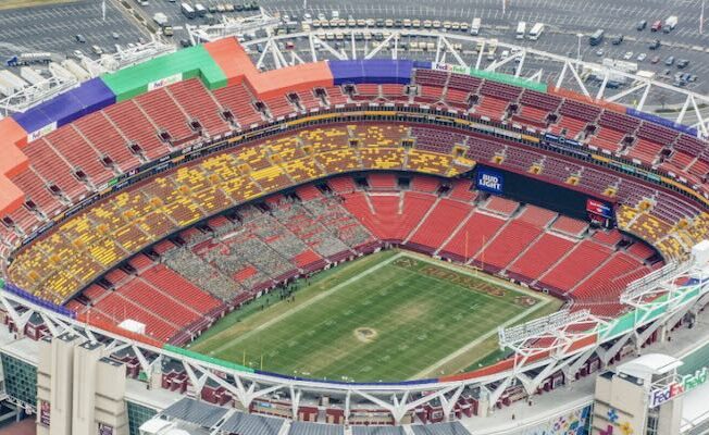 an aerial view of a stadium with a football field