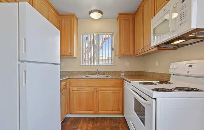 White Appliances In Kitchen at Colonial Garden Apartments, San Mateo, California