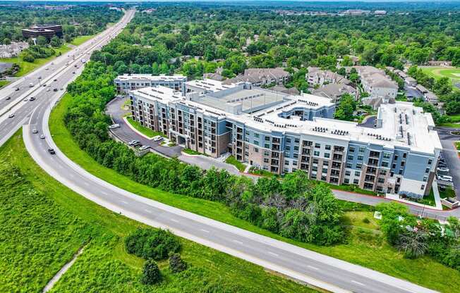 A large building with a parking lot in front of it.
