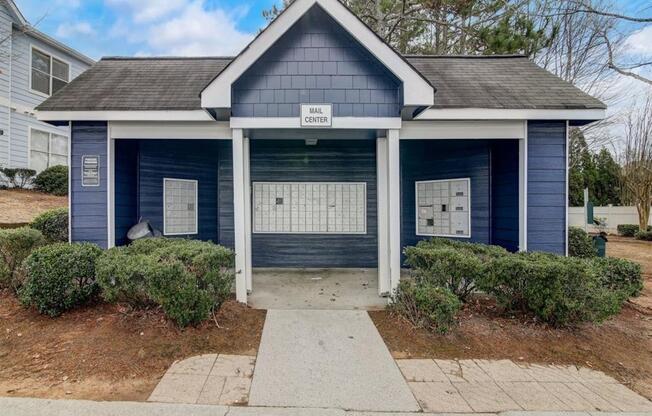 a small blue house with a sidewalk in front of it at The Sapphire, Decatur, GA, 30035