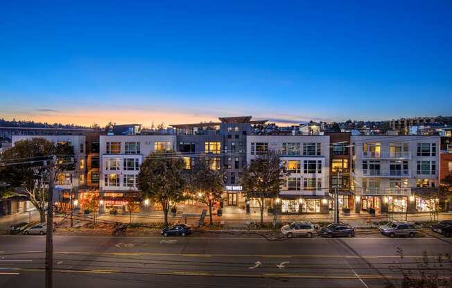 an aerial view of a city street at night with buildings at The Hayes on Stone Way, Washington, 98103