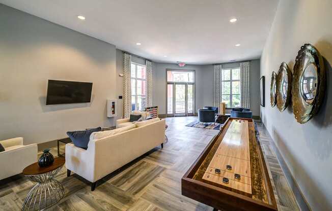 A Clubhouse With White Couch at The Aster Apartments, North Carolina, 27519