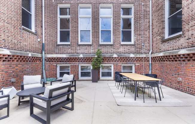 the courtyard at our apartments has a seating area and tables