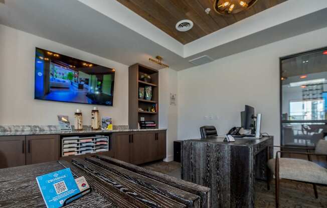 A modern living room with a television and a coffee table.