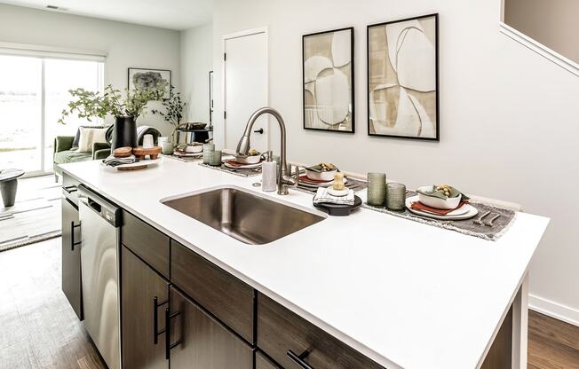 Studio, one two and three bedroom apartments and townhomes featuring open concept floor plans, dens, large windows, stainless steel appliances, quartz countertops, eat-in kitchens, pantries, LVT flooring and much more at The Trails at North Streams in Omaha, NE