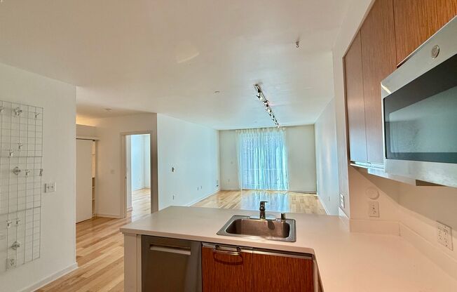 1BR + Den / 1BA with Private Patio + Parking!
