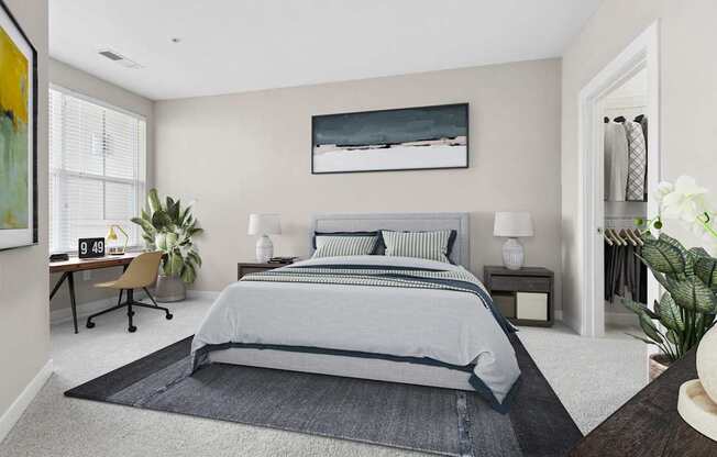 A bedroom with a large bed and a painting on the wall.