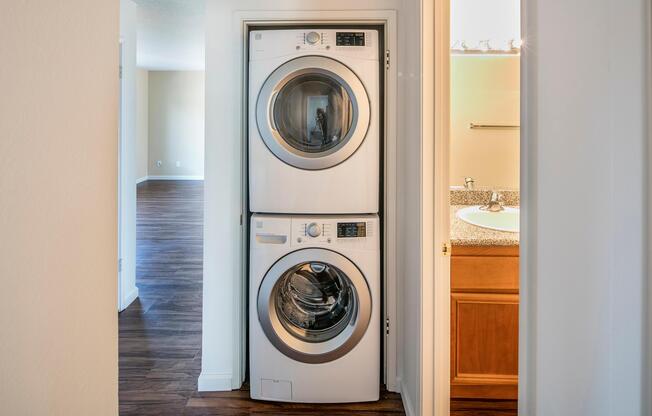 a clock sitting in front of a mirror posing for the camera