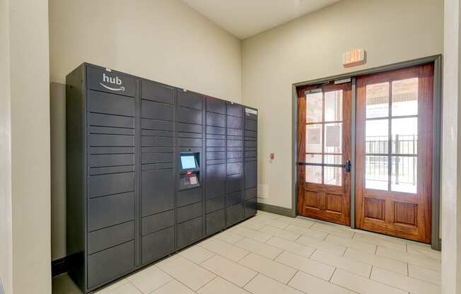 the lobby of a building with a door and a locker