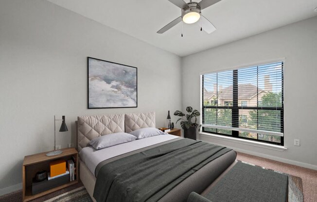 a bedroom with a large bed and a large window