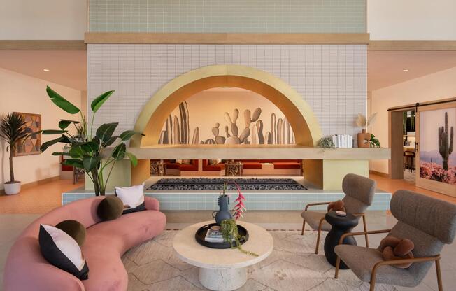A statement lobby with desert tones, layered lighting, and inviting seating—welcome home to Modera Rio Salado.