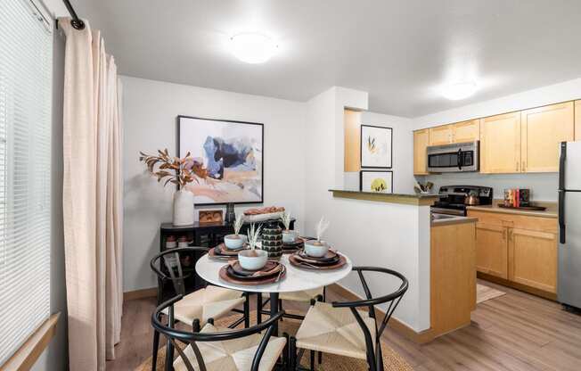 our apartments at the district feature a dining room table and a kitchen